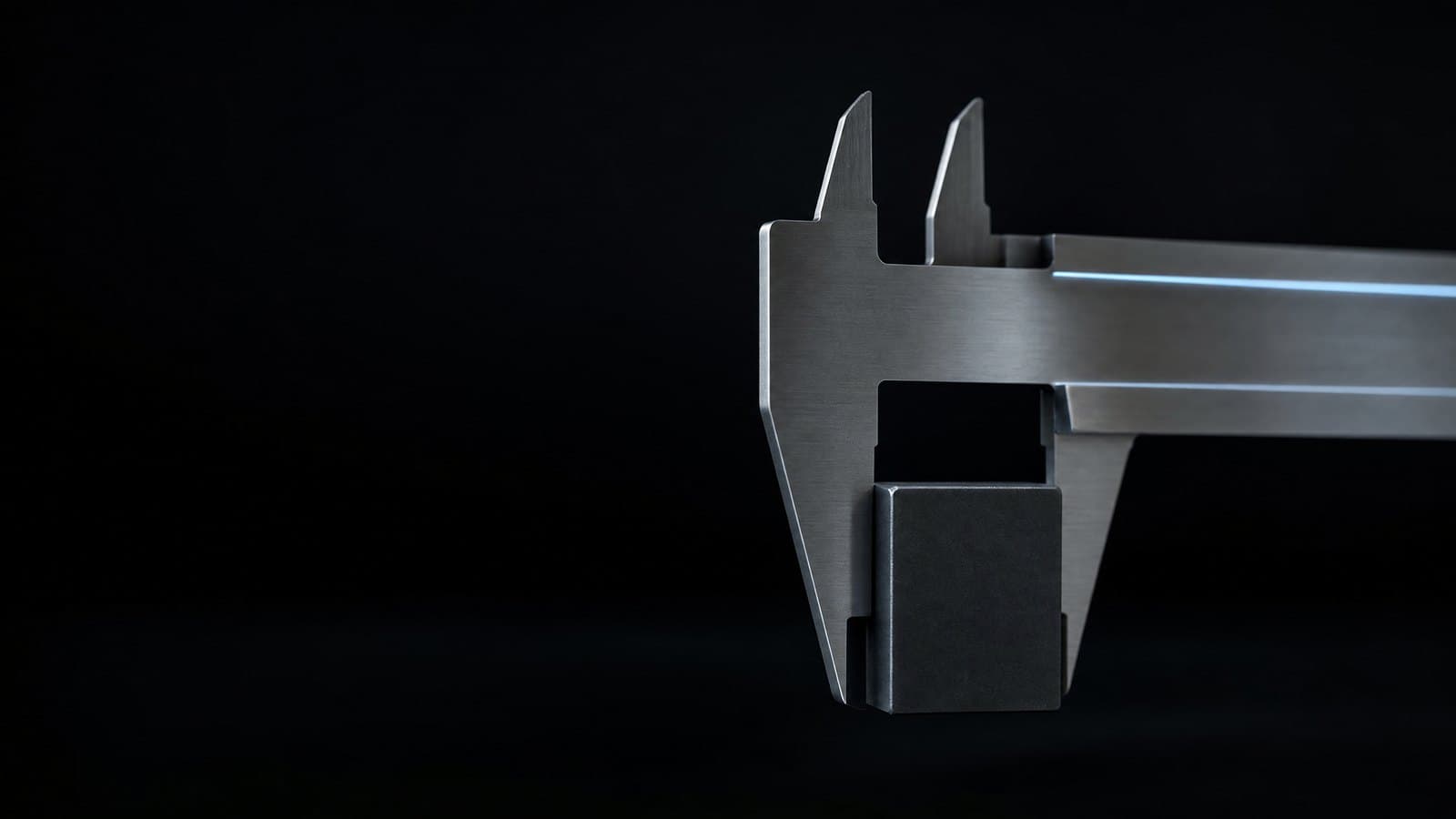 A precision caliper closing on a machined block, representing pricing a build from measured findings rather than an estimate